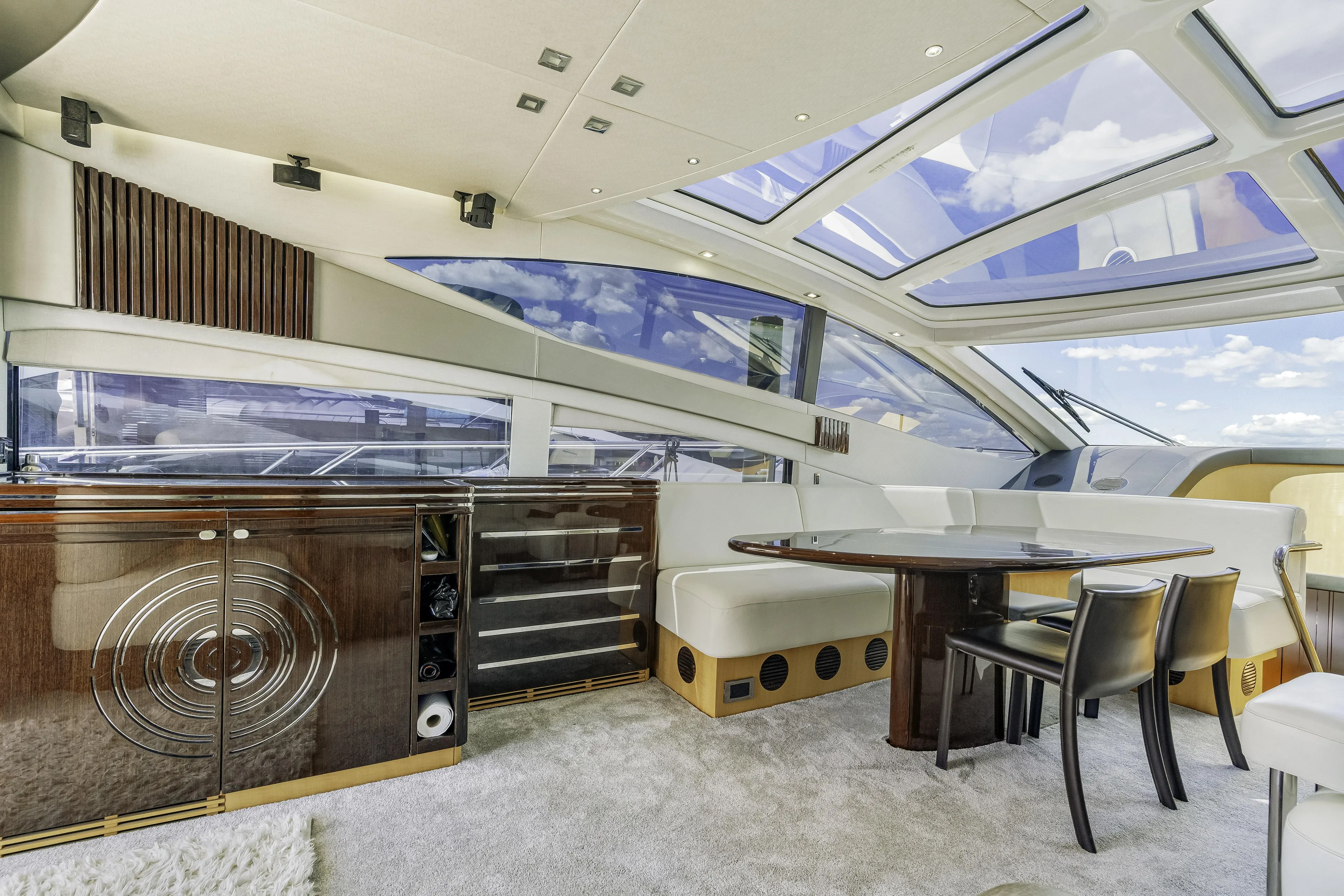  Yacht Photos Pics Luxurious interior of 2014 Sunseeker 68 Sport Yacht with elegant dining area and panoramic windows.