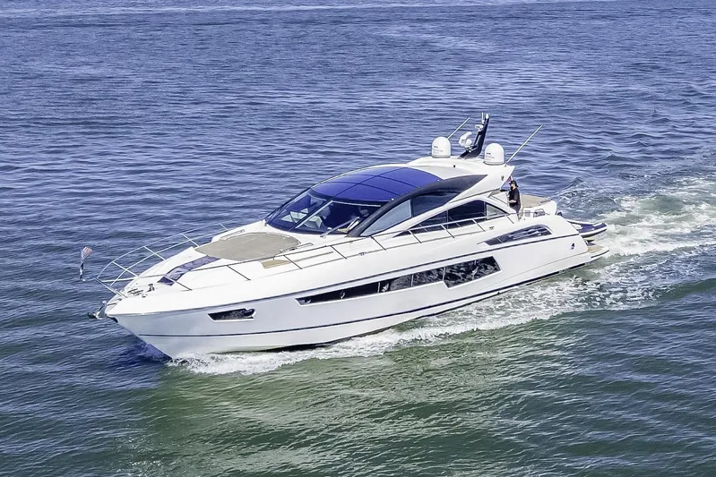  Yacht Photos Pics 2014 Sunseeker 68 Sport Yacht cruising on open water under clear blue sky.