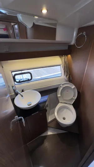  Yacht Photos Pics 2019 Jeanneau NC Weekender 1095 bathroom with modern sink and toilet.