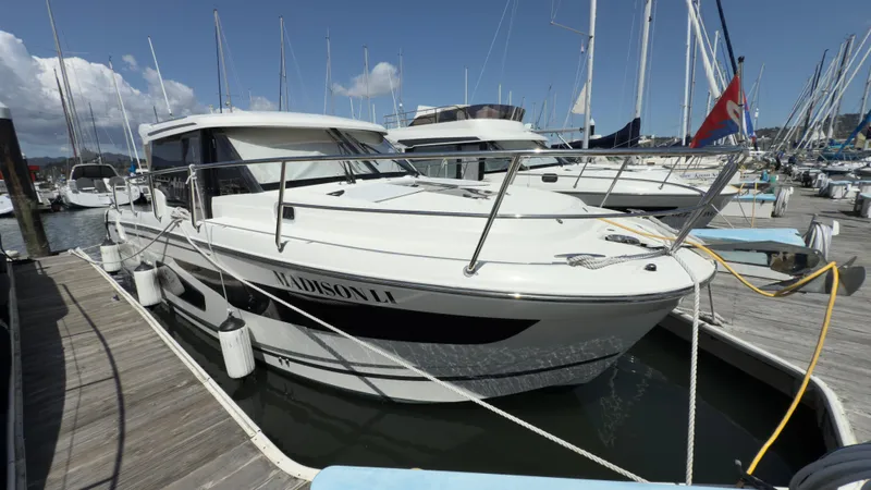  Yacht Photos Pics 2019 Jeanneau NC Weekender 1095 docked at marina under clear skies.