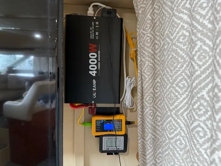 Jet Lag Yacht Photos Pics Power inverter setup on 1999 Sea Ray 400 Sedan Bridge yacht interior.