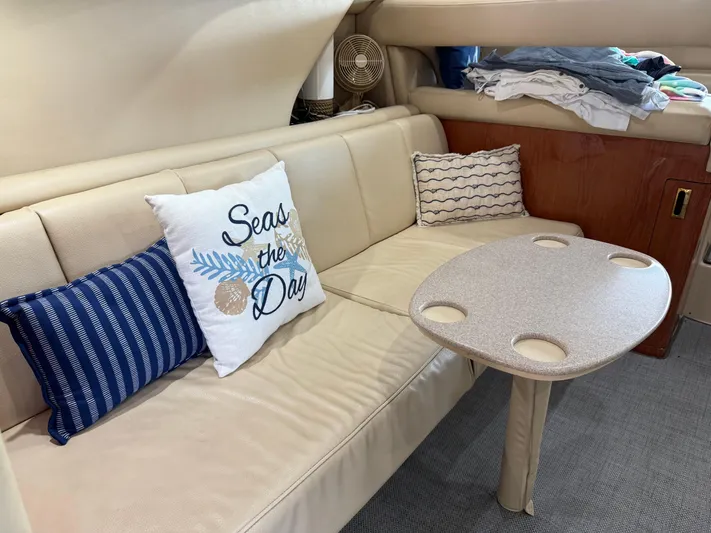 Jet Lag Yacht Photos Pics Interior of 1999 Sea Ray 400 Sedan Bridge with cozy seating and decorative pillows.