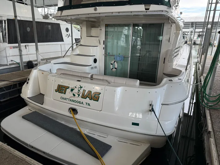 Jet Lag Yacht Photos Pics 1999 Sea Ray 400 Sedan Bridge docked, rear view with "Jet Lag" signage, Chattanooga, TN.