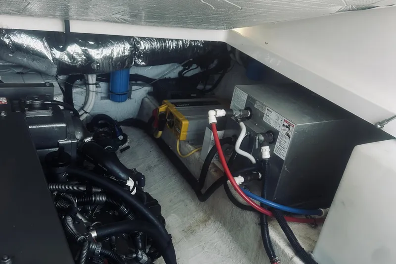 Sister's Yacht Photos Pics Engine compartment of a 2013 Back Cove 30 boat, showing mechanical components and wiring.