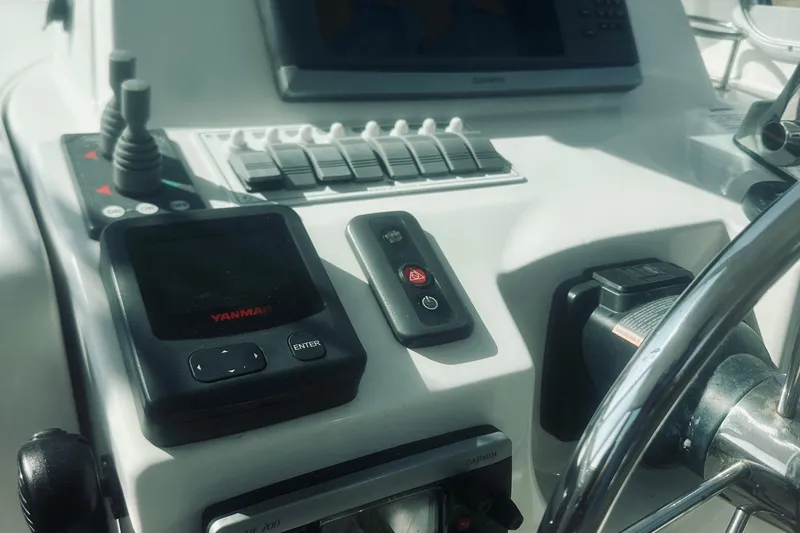 Sister's Yacht Photos Pics Control panel of a 2013 Back Cove 30 boat with Yanmar and Garmin displays.