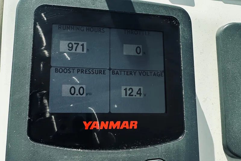 Sister's Yacht Photos Pics Yanmar engine display showing 971 running hours, 0% throttle, 0.0 psi boost, 12.4V battery. Back Cove 30, 2013.