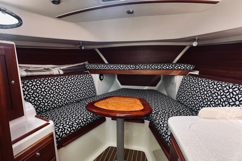 Sister's Yacht Photos Pics 2013 Back Cove 30 interior with patterned seating and wooden accents.