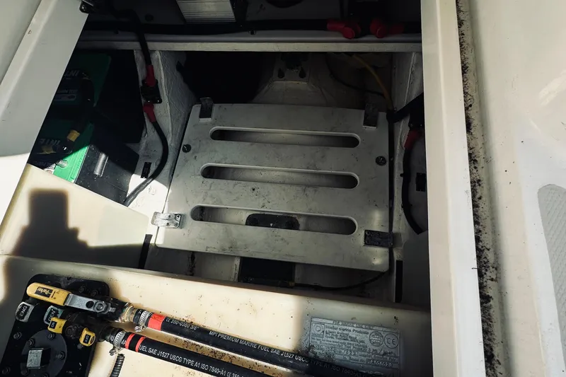 Sister's Yacht Photos Pics Engine compartment of a 2013 Back Cove 30 boat, showing battery and wiring.