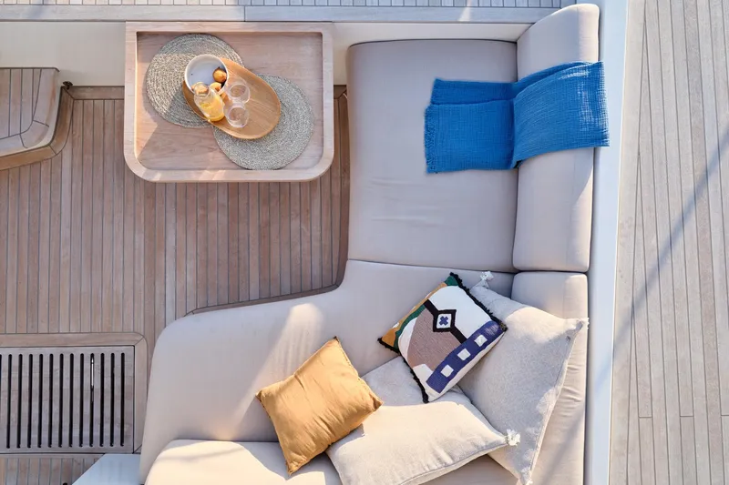  Yacht Photos Pics Luxurious 2023 Lagoon Seventy 7 yacht deck with cozy seating and decorative pillows.