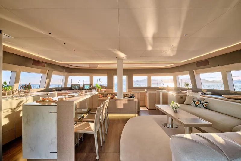  Yacht Photos Pics Luxurious interior of 2023 Lagoon Seventy 7 yacht with modern design and panoramic windows.