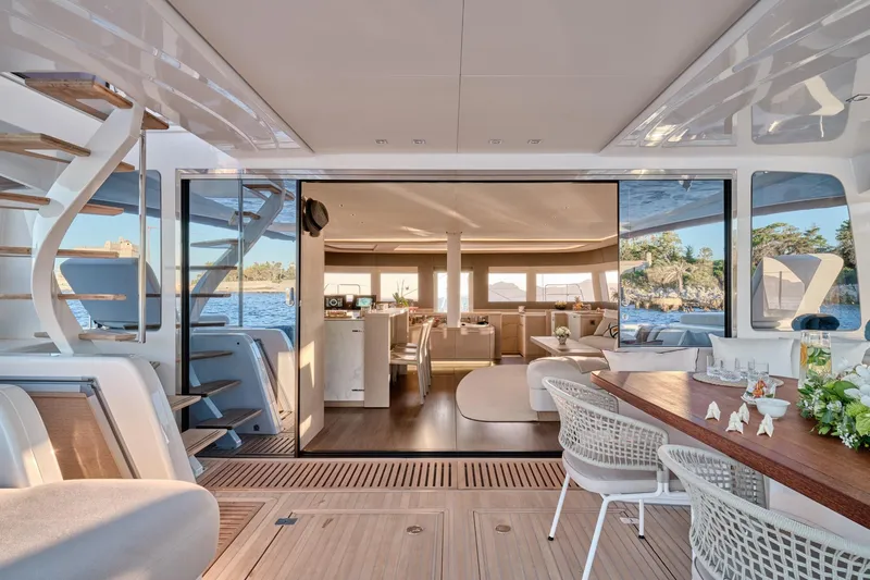  Yacht Photos Pics Luxurious 2023 Lagoon Seventy 7 yacht interior with elegant dining and seating areas.