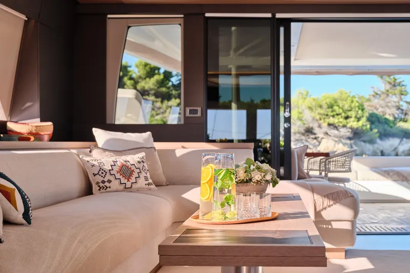  Yacht Photos Pics Luxurious interior of 2023 Lagoon Seventy 7 yacht with elegant seating and decor.