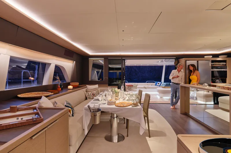  Yacht Photos Pics Luxurious interior of 2023 Lagoon Seventy 7 yacht with elegant dining setup.