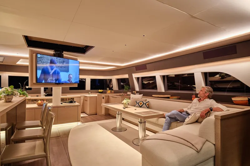  Yacht Photos Pics Luxurious interior of 2023 Lagoon Seventy 7 yacht with modern furnishings and entertainment system.