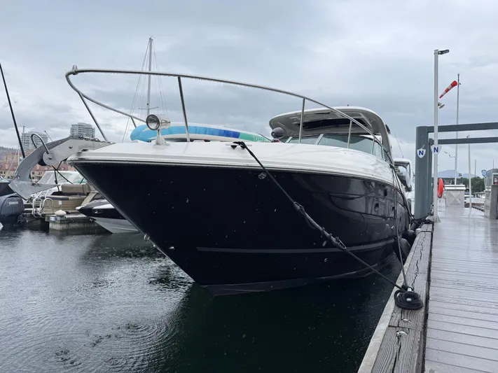 Andiamo Yacht Photos Pics 2016 Sea Ray 350 Sundancer docked at marina on a cloudy day.