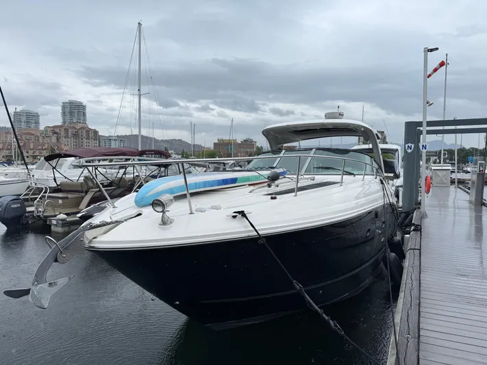 Andiamo Yacht Photos Pics 2016 Sea Ray 350 Sundancer yacht docked at marina on a cloudy day.