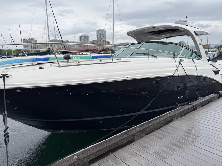 Andiamo Yacht Photos Pics 2016 Sea Ray 350 Sundancer docked at marina, overcast sky.