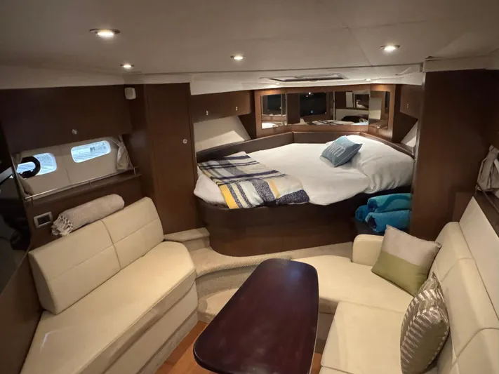 Andiamo Yacht Photos Pics Luxurious interior of 2016 Sea Ray 350 Sundancer yacht with cozy seating and bed.