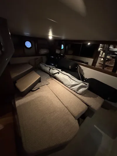 Andiamo Yacht Photos Pics Interior cabin of 2016 Sea Ray 350 Sundancer with cushioned seating and ambient lighting.