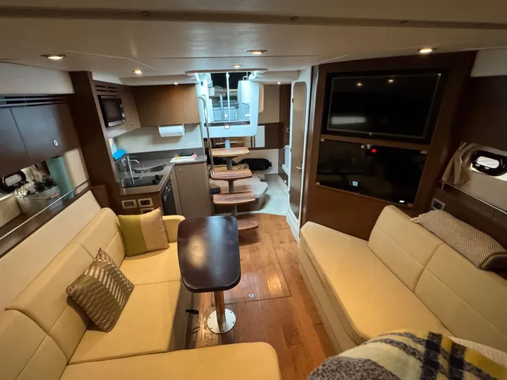 Andiamo Yacht Photos Pics Interior of 2016 Sea Ray 350 Sundancer yacht with modern seating and entertainment area.