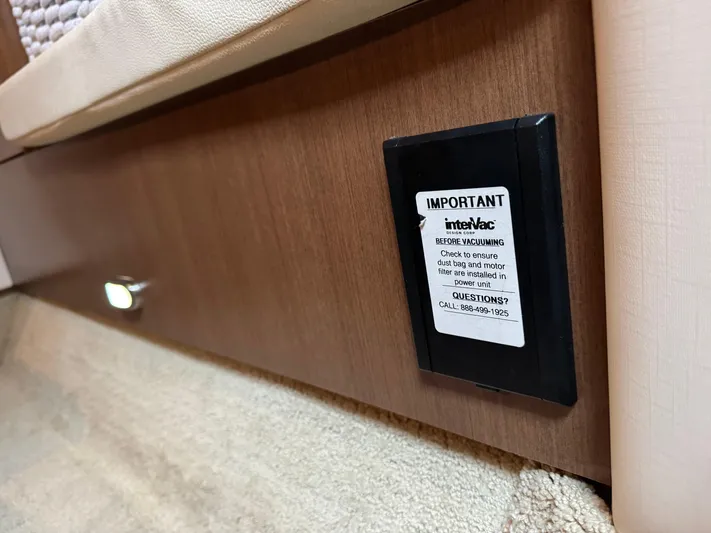 Andiamo Yacht Photos Pics 2016 Sea Ray 350 Sundancer interior detail with InteliVac system warning label.