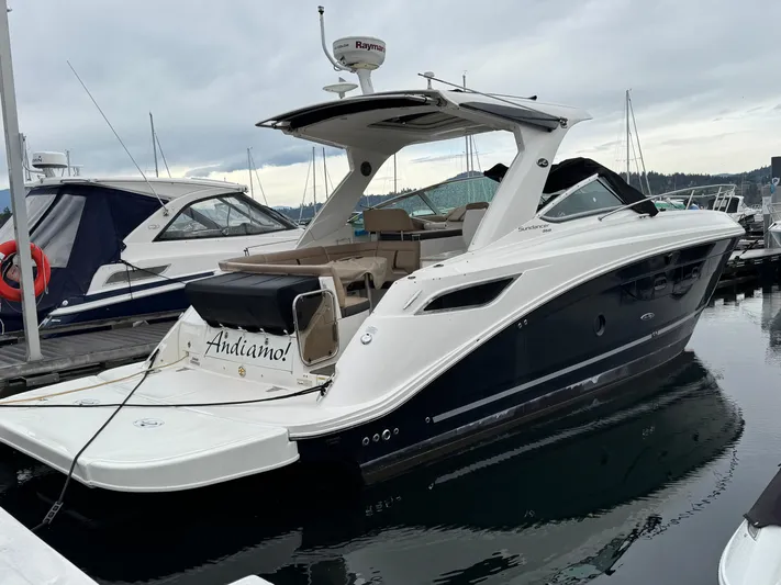 Andiamo Yacht Photos Pics 2016 Sea Ray 350 Sundancer yacht docked at marina, sleek design, white and navy exterior.