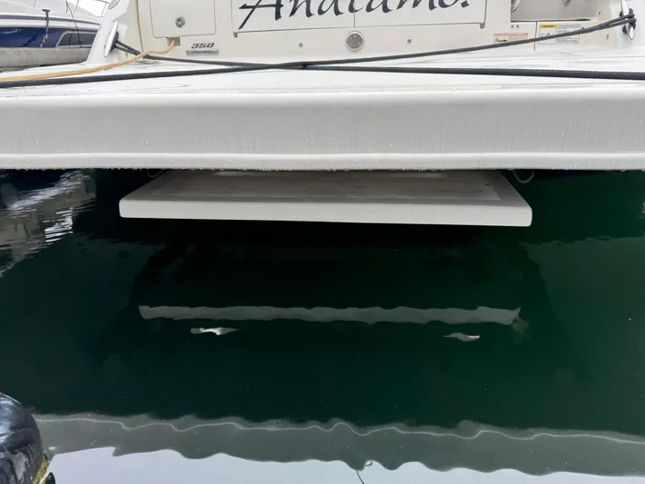 Andiamo Yacht Photos Pics 2016 Sea Ray 350 Sundancer boat stern view with swim platform over water.