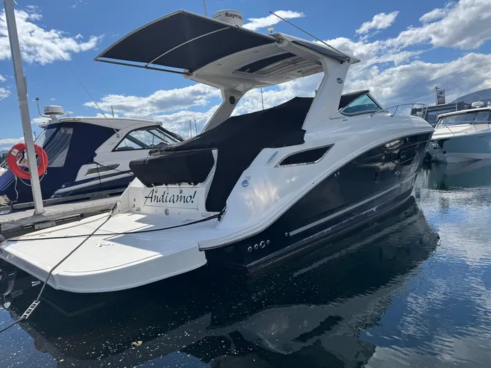 Andiamo Yacht Photos Pics 2016 Sea Ray 350 Sundancer yacht docked on a sunny day with blue skies.