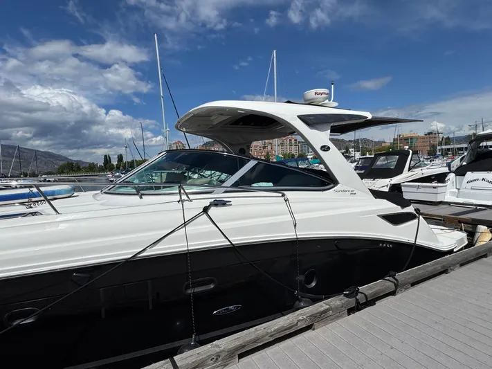Andiamo Yacht Photos Pics 2016 Sea Ray 350 Sundancer yacht docked at marina under blue sky.