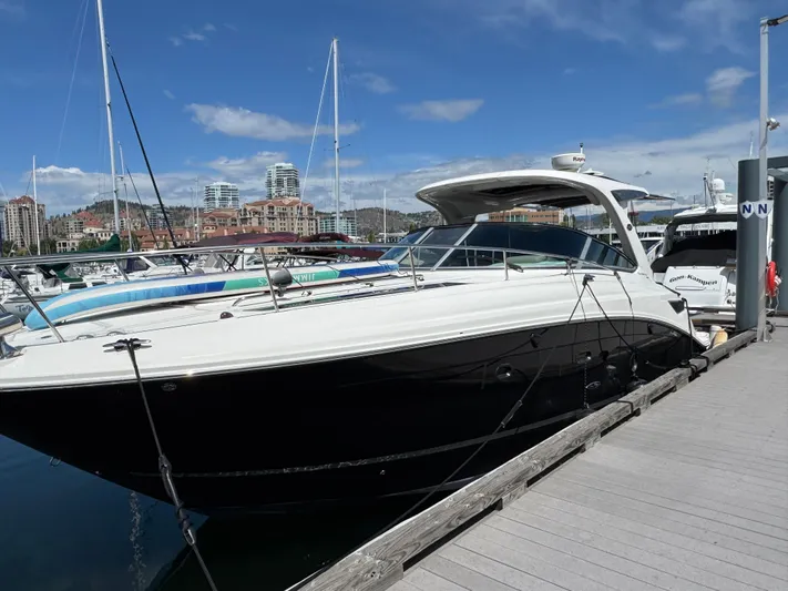 Andiamo Yacht Photos Pics 2016 Sea Ray 350 Sundancer yacht docked at marina under clear blue sky.