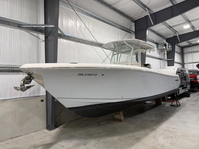  Yacht Photos Pics 2022 Sailfish 290cc boat in indoor storage facility.