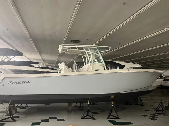  Yacht Photos Pics 2022 Sailfish 290cc boat displayed indoors on stands.
