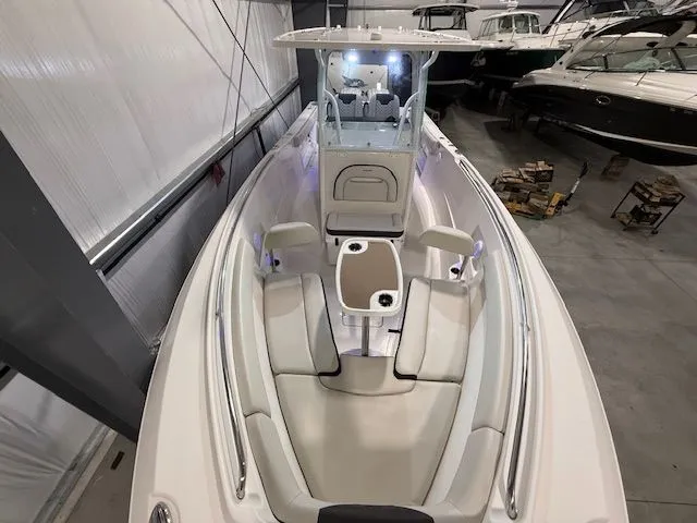  Yacht Photos Pics 2022 Sailfish 290cc boat interior with seating, in a storage facility.