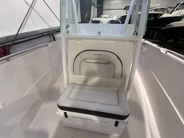  Yacht Photos Pics 2022 Sailfish 290cc boat interior with cushioned seating and storage compartment.