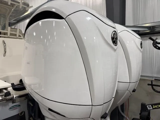  Yacht Photos Pics Twin outboard engines on a 2022 Sailfish 290cc boat, showcasing sleek design and power.