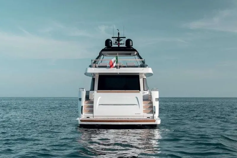 Yacht Photos Pics 2022 Sanlorenzo SL86 yacht on open sea, rear view with clear sky.