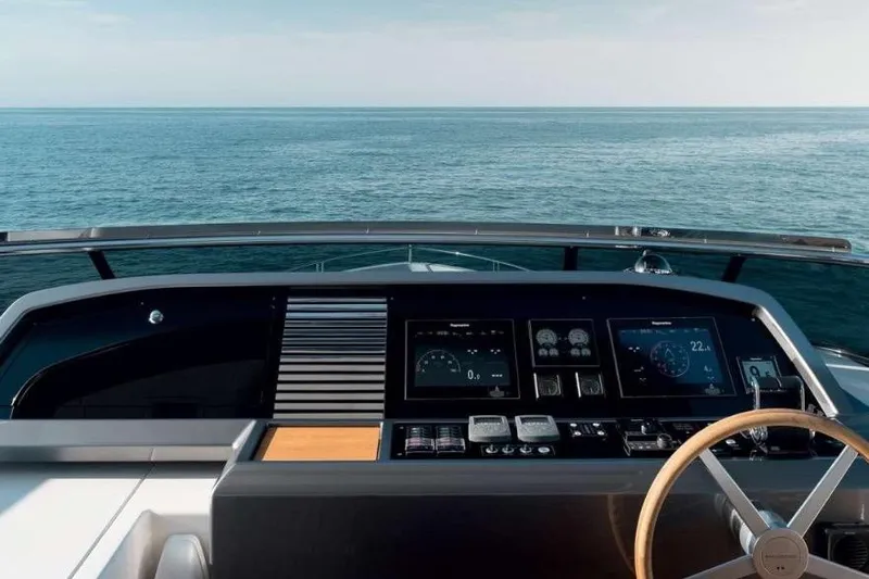  Yacht Photos Pics Helm of 2022 Sanlorenzo SL86 yacht with ocean view, featuring modern navigation controls.