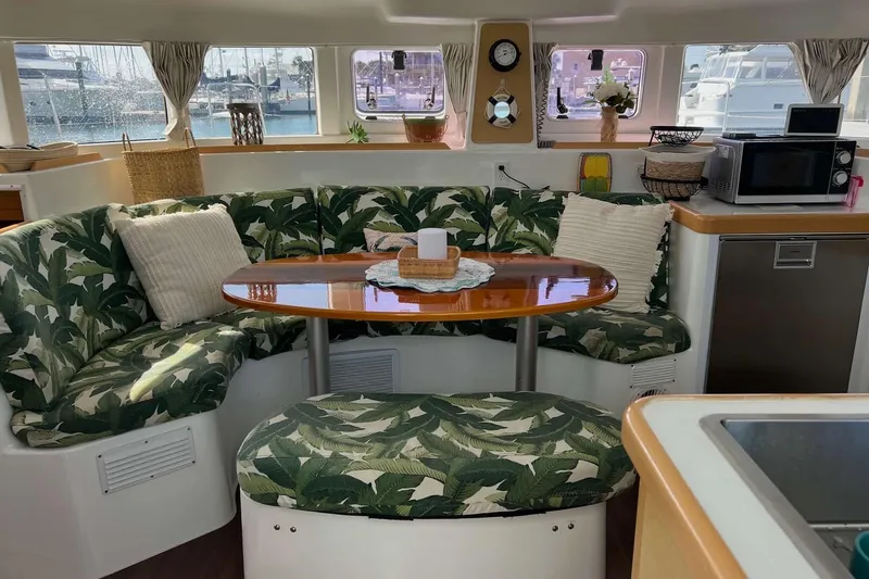 Apres-sea Yacht Photos Pics Interior of 2012 Lagoon 380 S2 catamaran with tropical-themed seating and dining area.