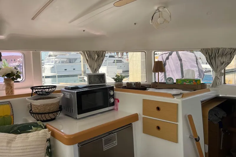 Apres-sea Yacht Photos Pics Interior of 2012 Lagoon 380 S2 catamaran with kitchen appliances and marina view.