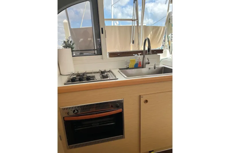 Apres-sea Yacht Photos Pics Modern kitchen in 2012 Lagoon 380 S2 yacht with stove, sink, and oven.