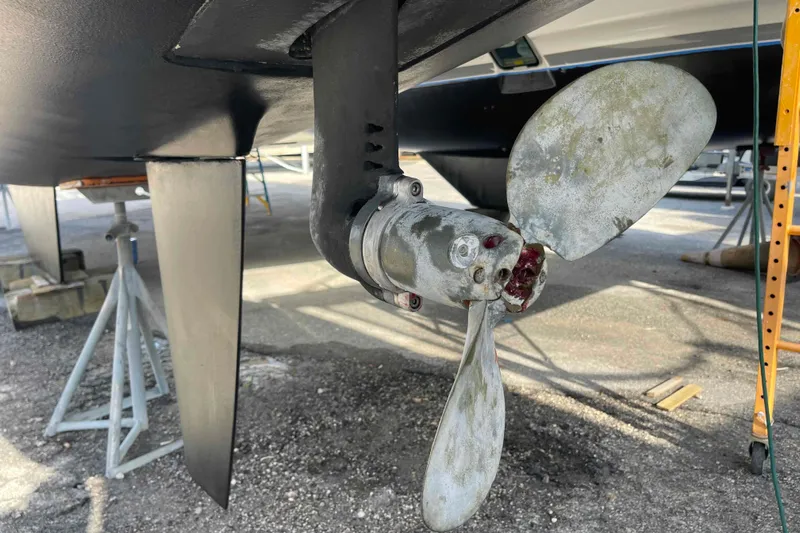 Apres-sea Yacht Photos Pics Propeller of 2012 Lagoon 380 S2 catamaran on dry dock, showing wear and maintenance needs.