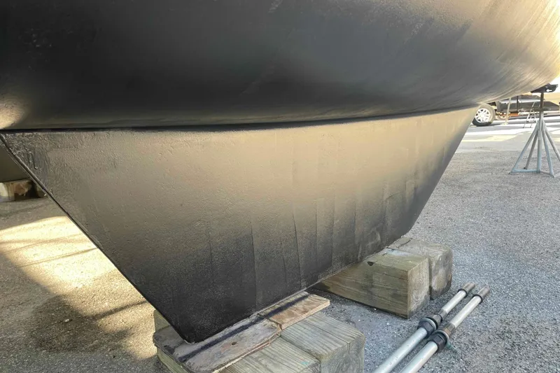 Apres-sea Yacht Photos Pics Bottom view of 2012 Lagoon 380 S2 catamaran hull on wooden blocks.