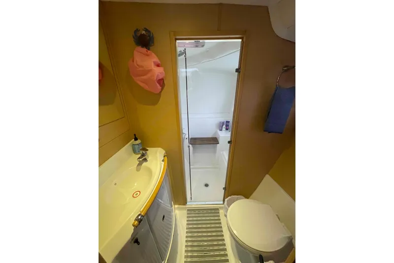 Apres-sea Yacht Photos Pics Bathroom interior of 2012 Lagoon 380 S2 catamaran with shower and sink.