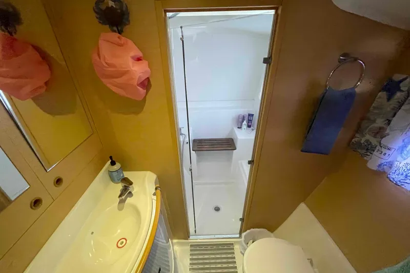 Apres-sea Yacht Photos Pics Bathroom interior of 2012 Lagoon 380 S2 yacht with shower and sink.