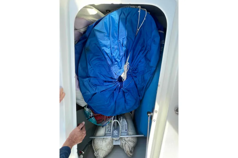 Apres-sea Yacht Photos Pics Storage compartment of 2012 Lagoon 380 S2 with blue cover and nautical equipment.