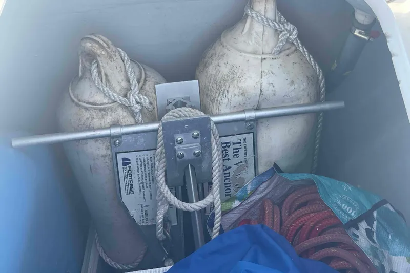 Apres-sea Yacht Photos Pics Storage compartment on a 2012 Lagoon 380 S2 with fenders, anchor, and ropes.