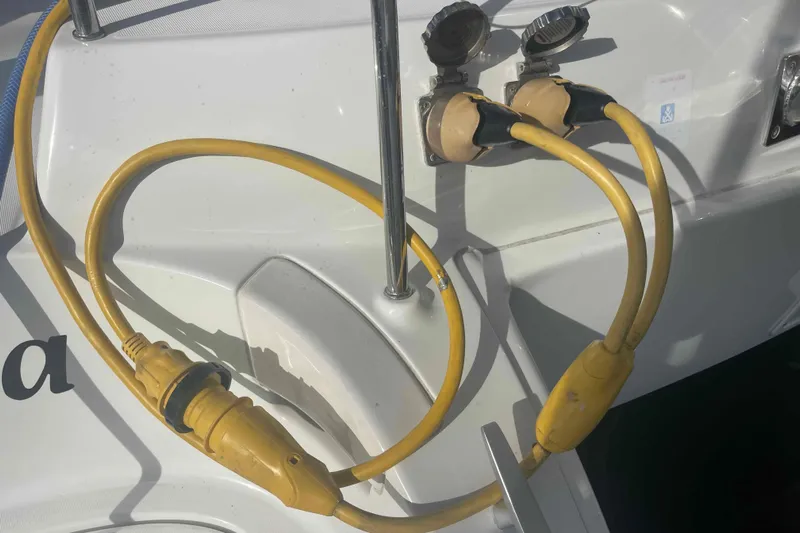 Apres-sea Yacht Photos Pics Yellow power cables on a 2012 Lagoon 380 S2 yacht's exterior.