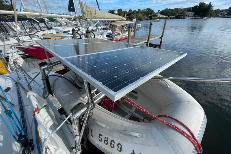 Apres-sea Yacht Photos Pics 2012 Lagoon 380 S2 catamaran with solar panels and dinghy at dockside.