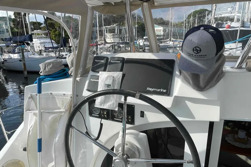 Apres-sea Yacht Photos Pics Steering wheel and navigation equipment on a 2012 Lagoon 380 S2 catamaran.