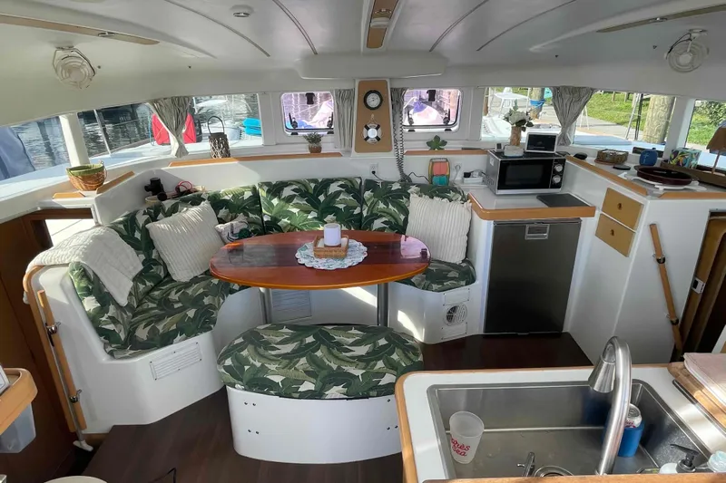 Apres-sea Yacht Photos Pics Interior of 2012 Lagoon 380 S2 catamaran with cozy seating and modern kitchen amenities.